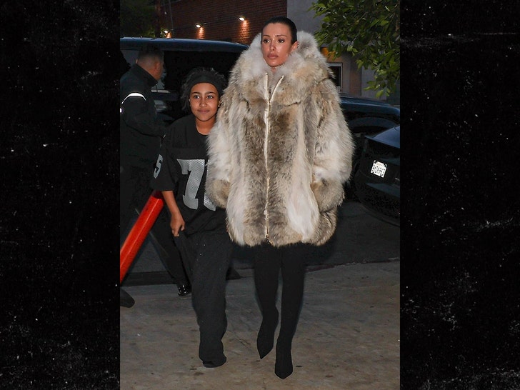 Bianca Censori Covers Up in Fur for Dinner with Kanye and North West