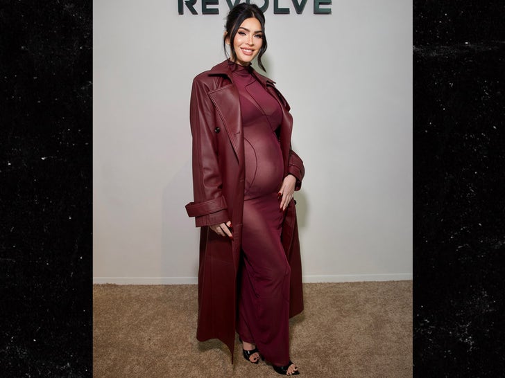 Megan Fox Reveals Off Child Bump in Sheer Burgundy Costume & Matching Thong